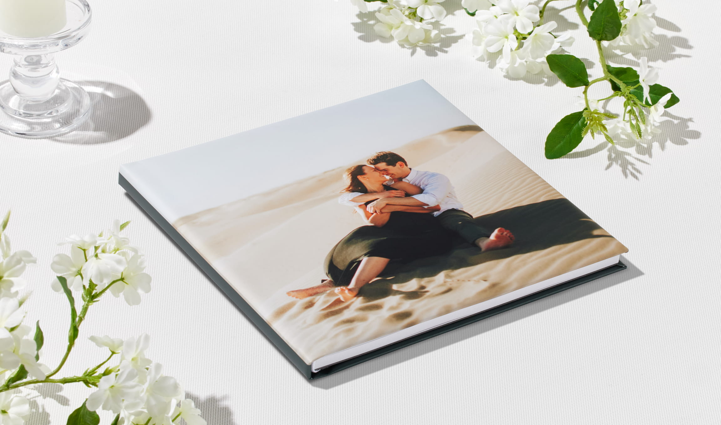 Layflat photo book opened to a full-spread wedding portrait